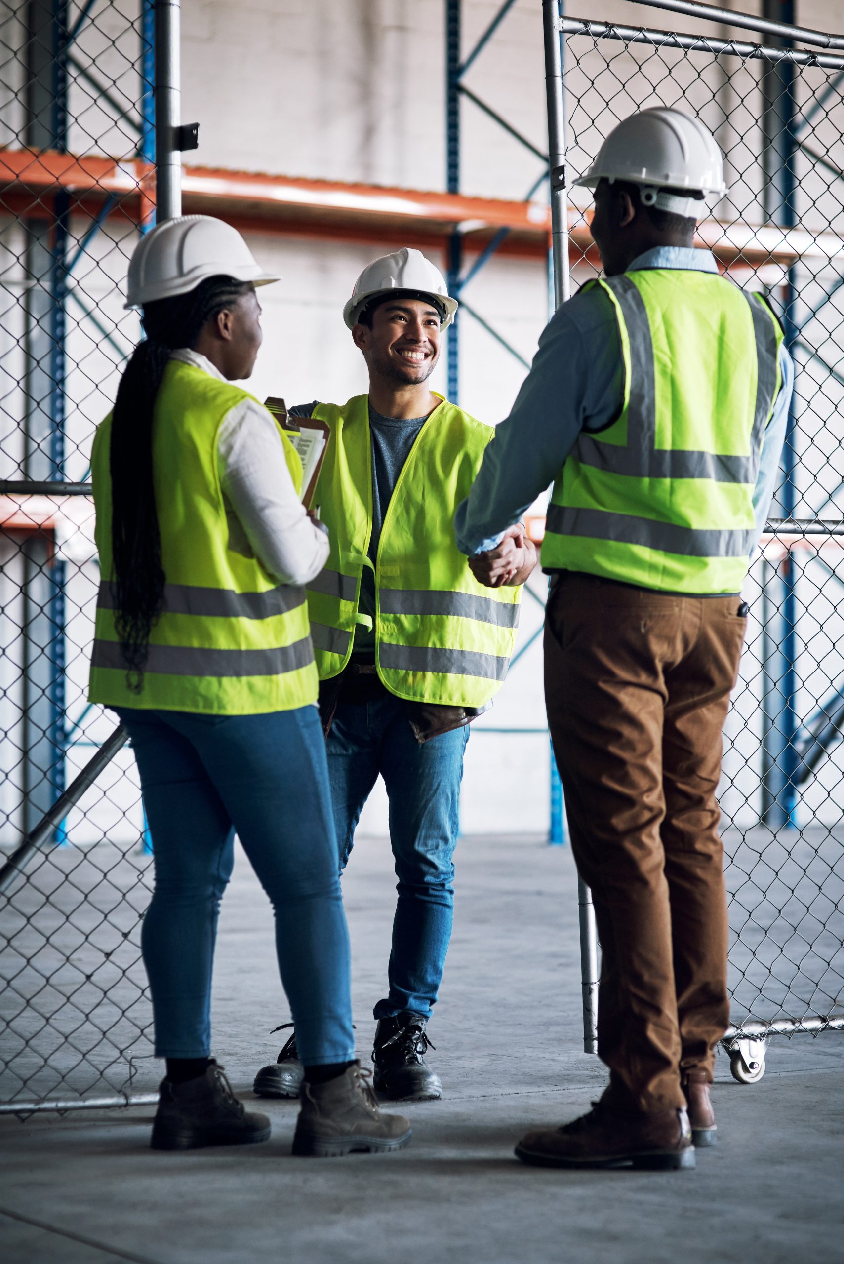 Shot of builders shaking hands at a construction site